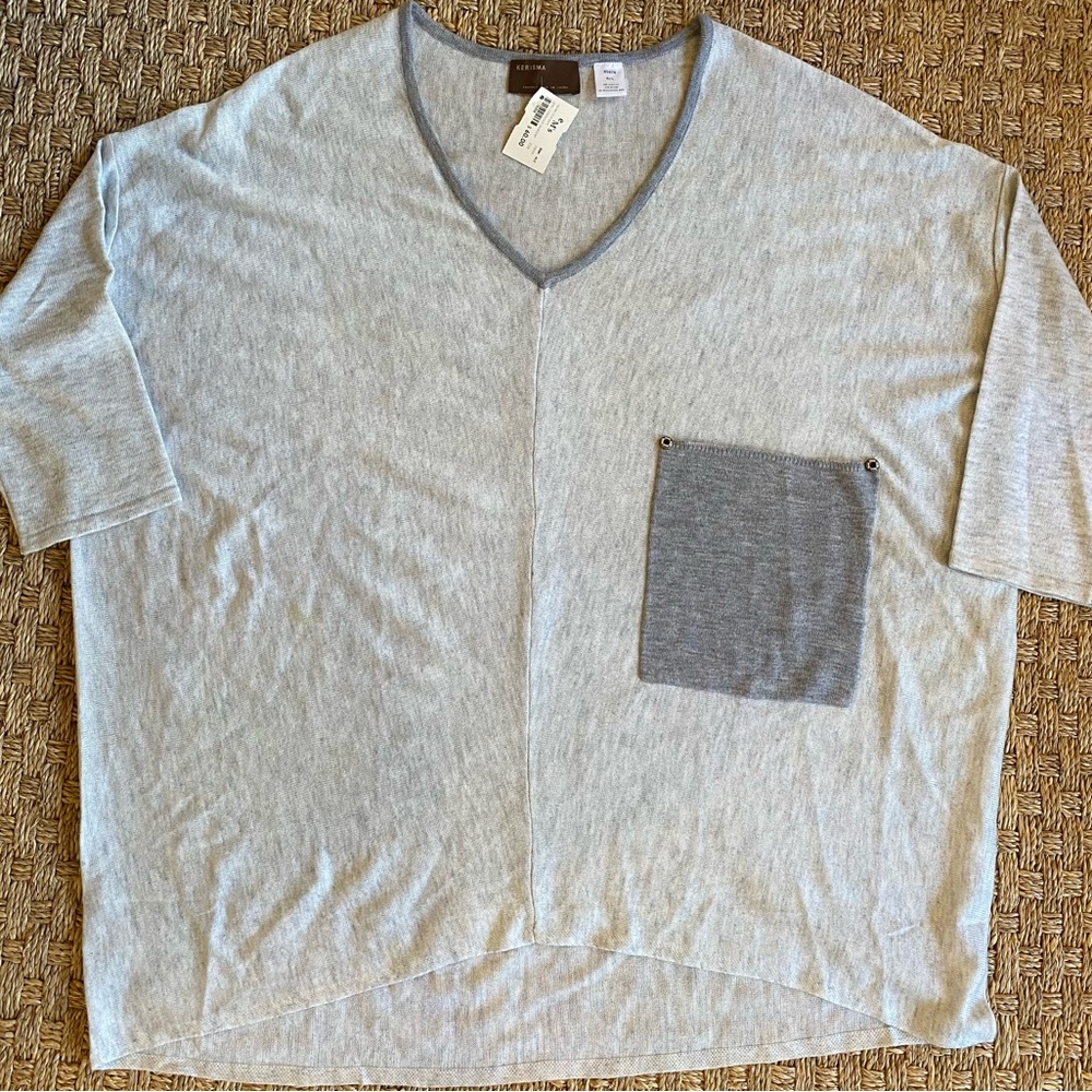NWT V-neck soft loose fitting light grey sweater. Size M/L